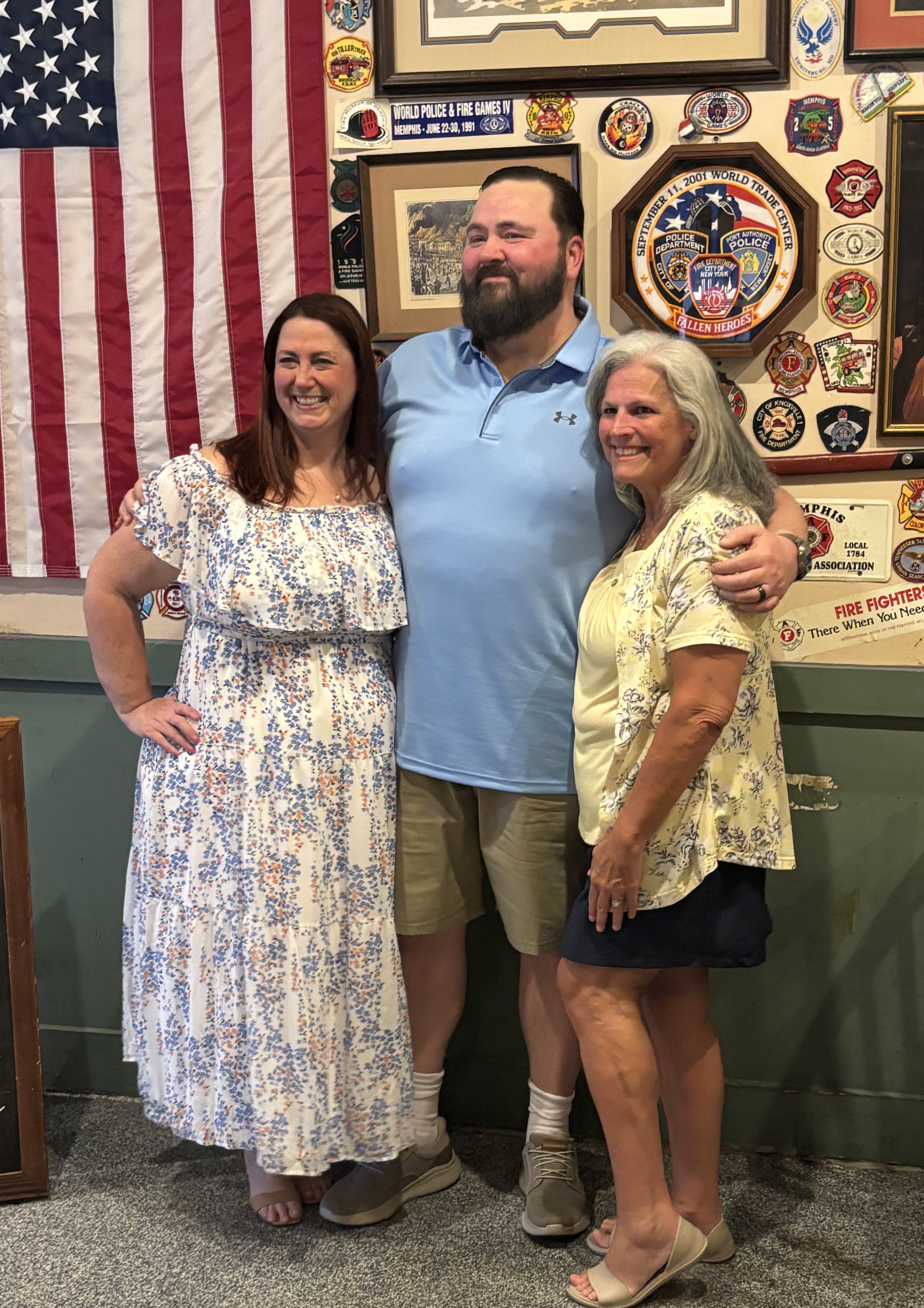Beth with a couple on their wedding day